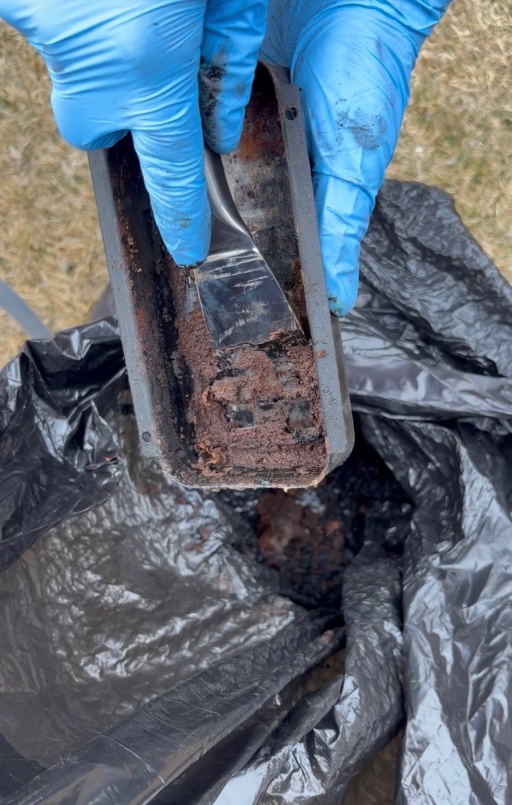 Dirty BBQ grease trap before cleaning